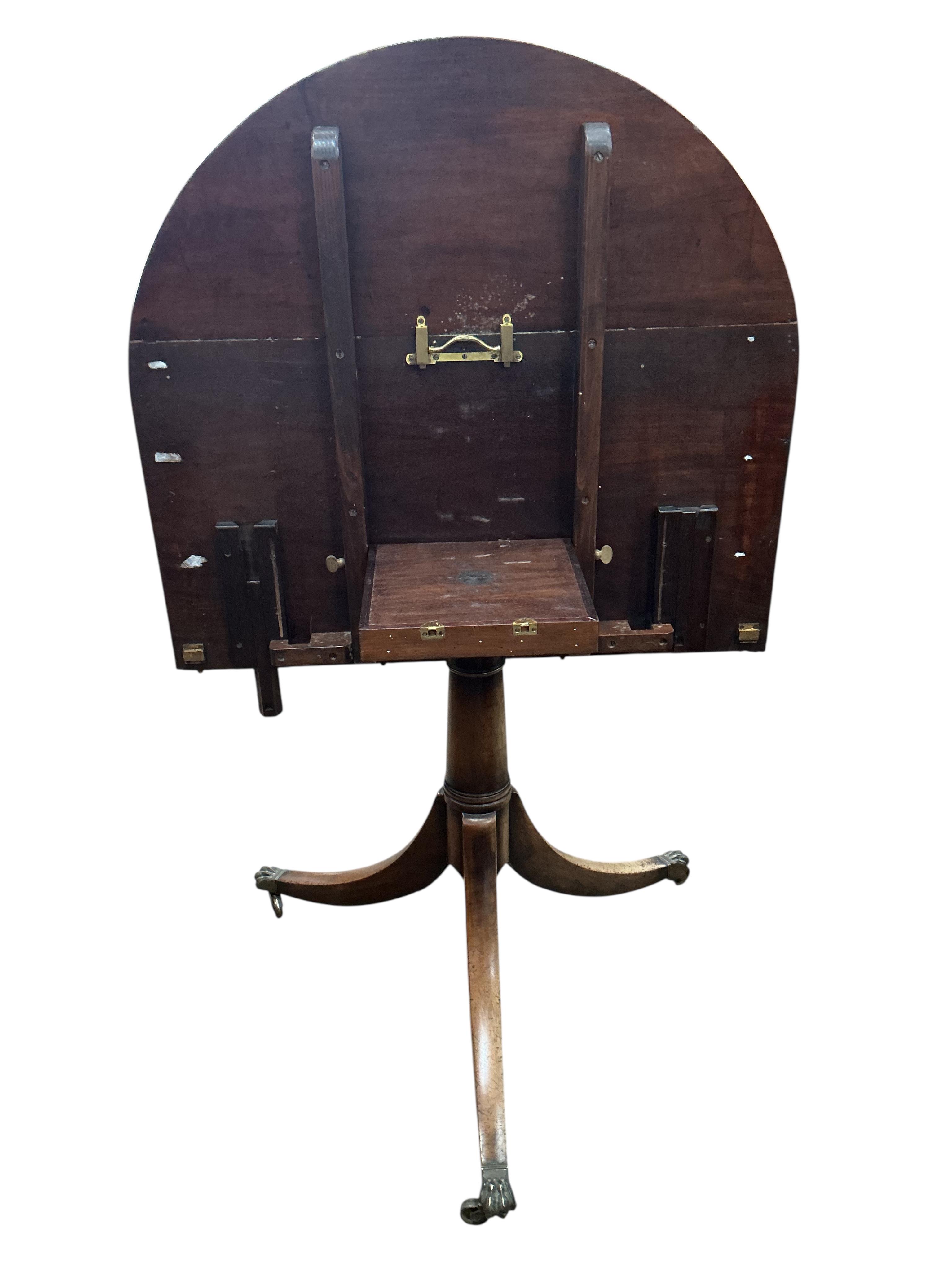 A George III style mahogany twin pillar 'D' end extending dining table, width 260cm extended, two spare leaves, depth 91cm, height 72cm